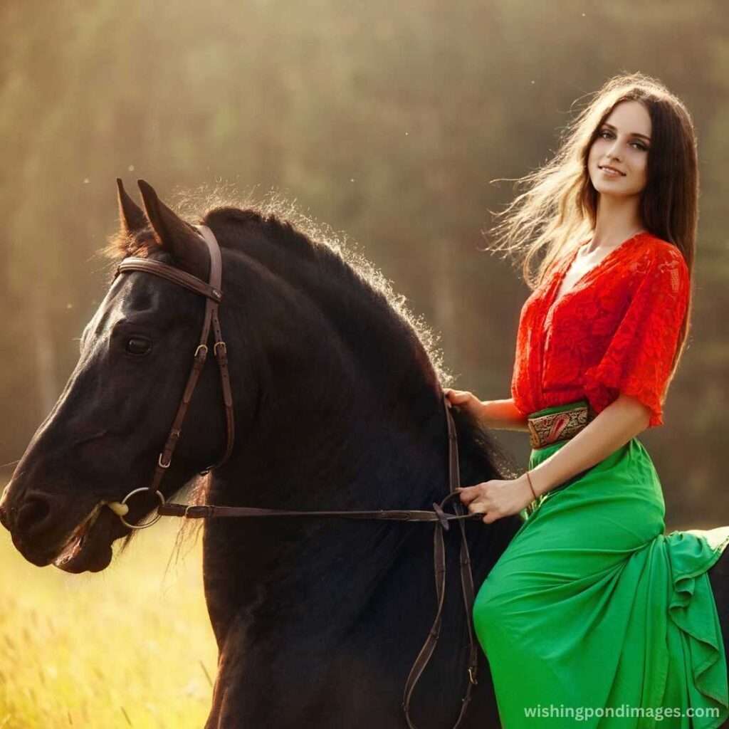 A girl rides a horse in a field in the summer - Nature Images