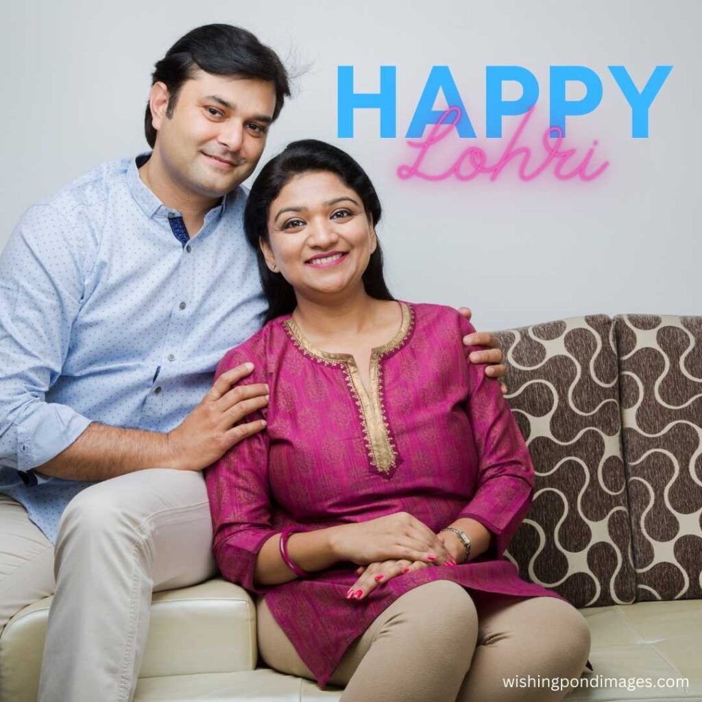 An Indian couple wishing happy lohri sitting in sofa - Happy Lohri Images