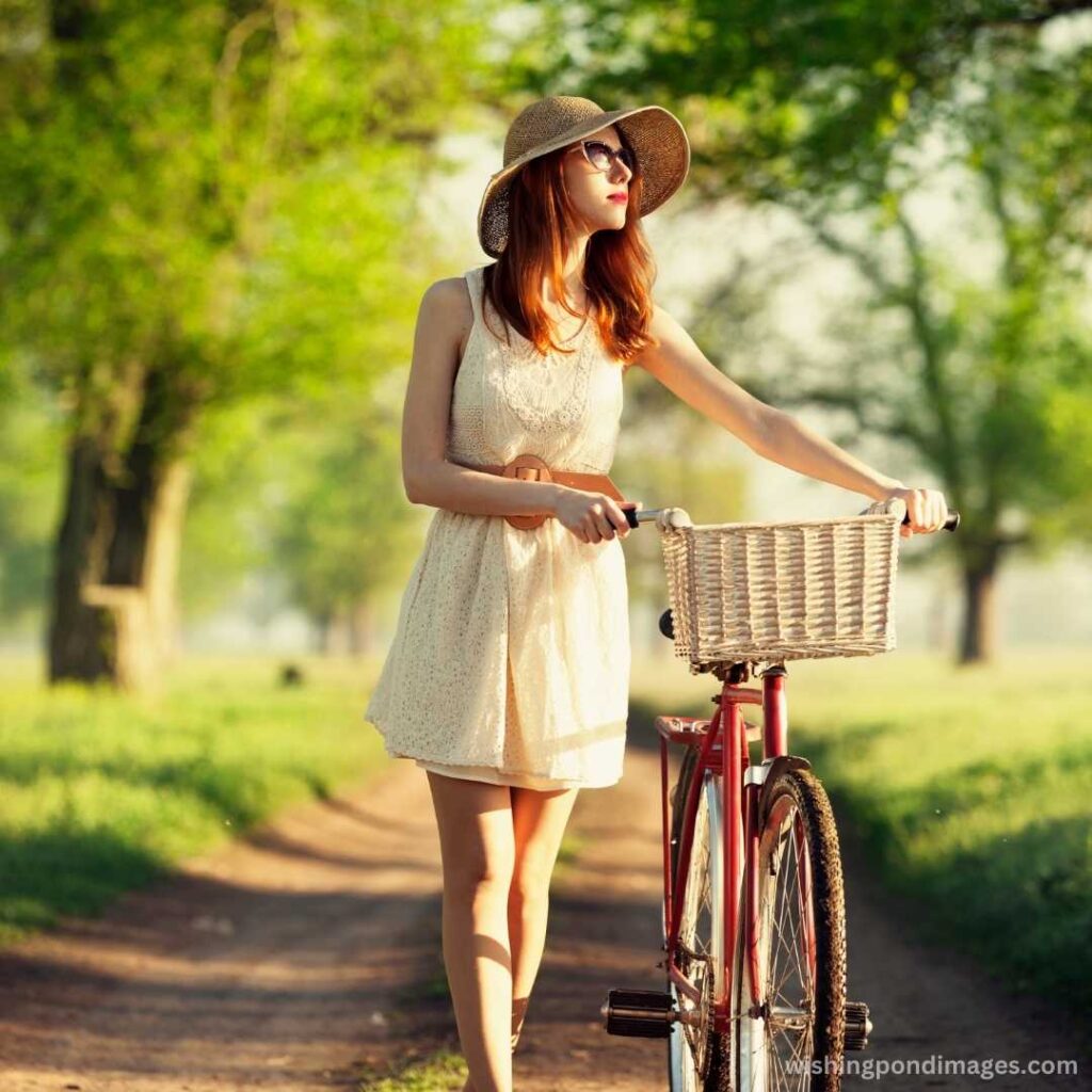 Girl on a bike in the countryside - Nature Images