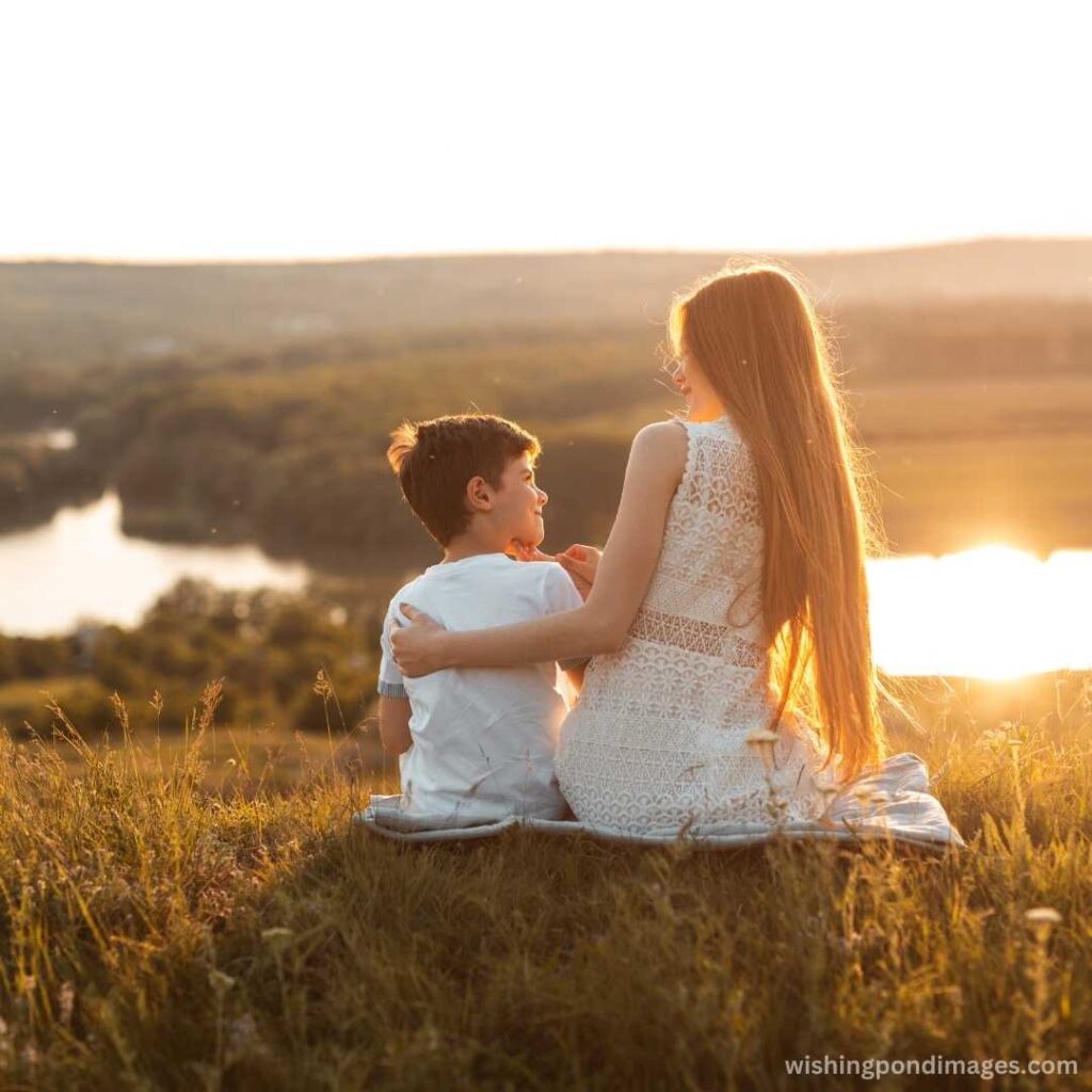 Happy brother and sister resting in the evening countryside - Nature Images