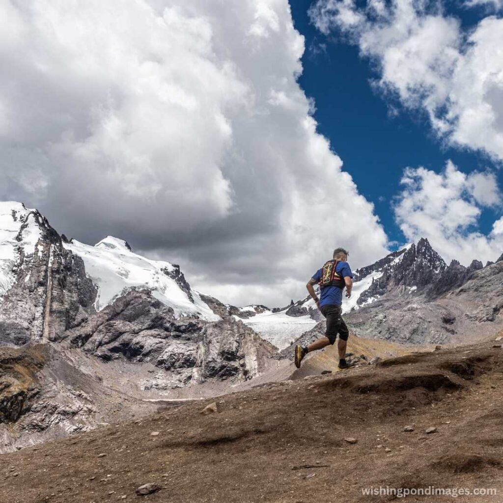 Man running in the mountains - Nature Images