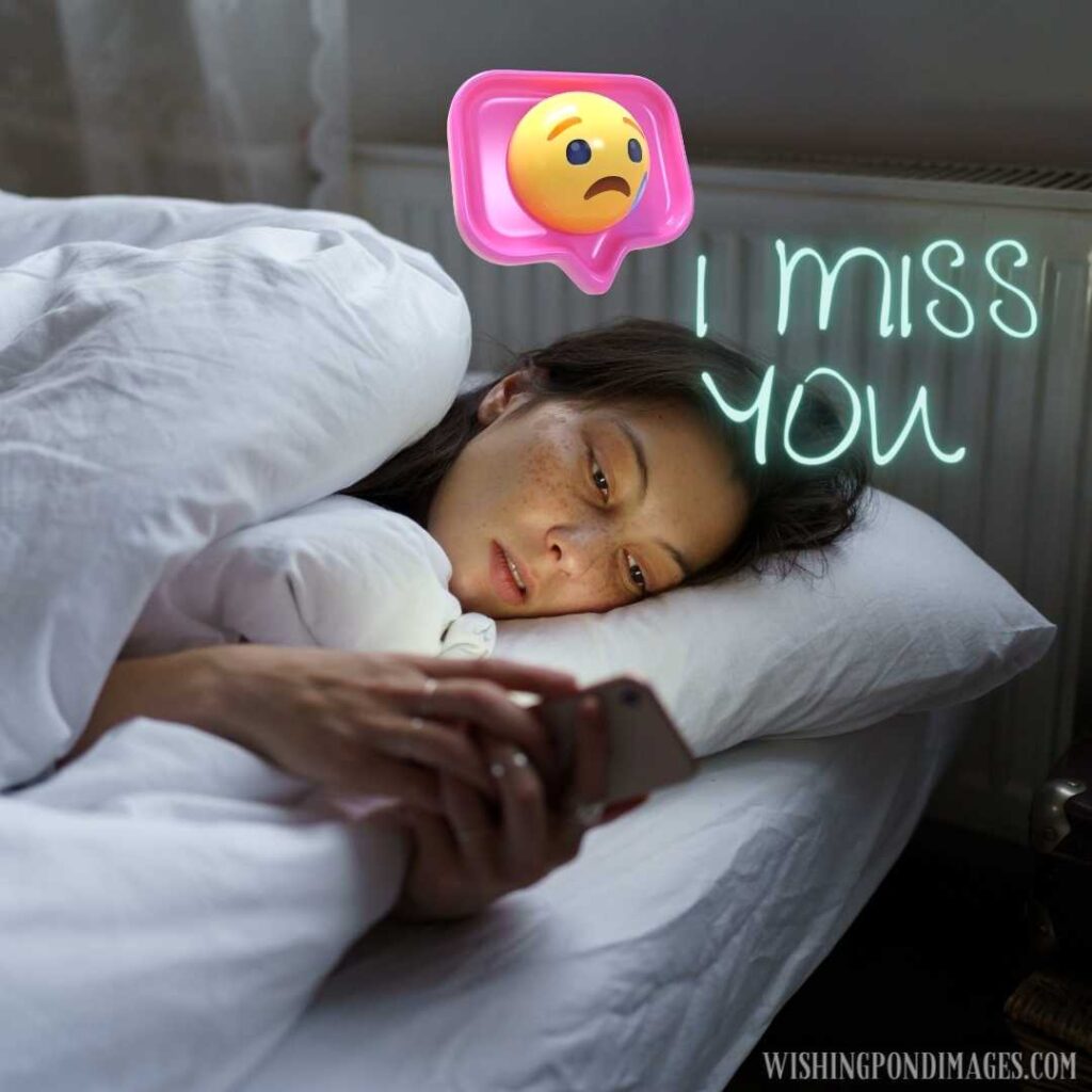 A sad girl sleepless in bed with smartphone