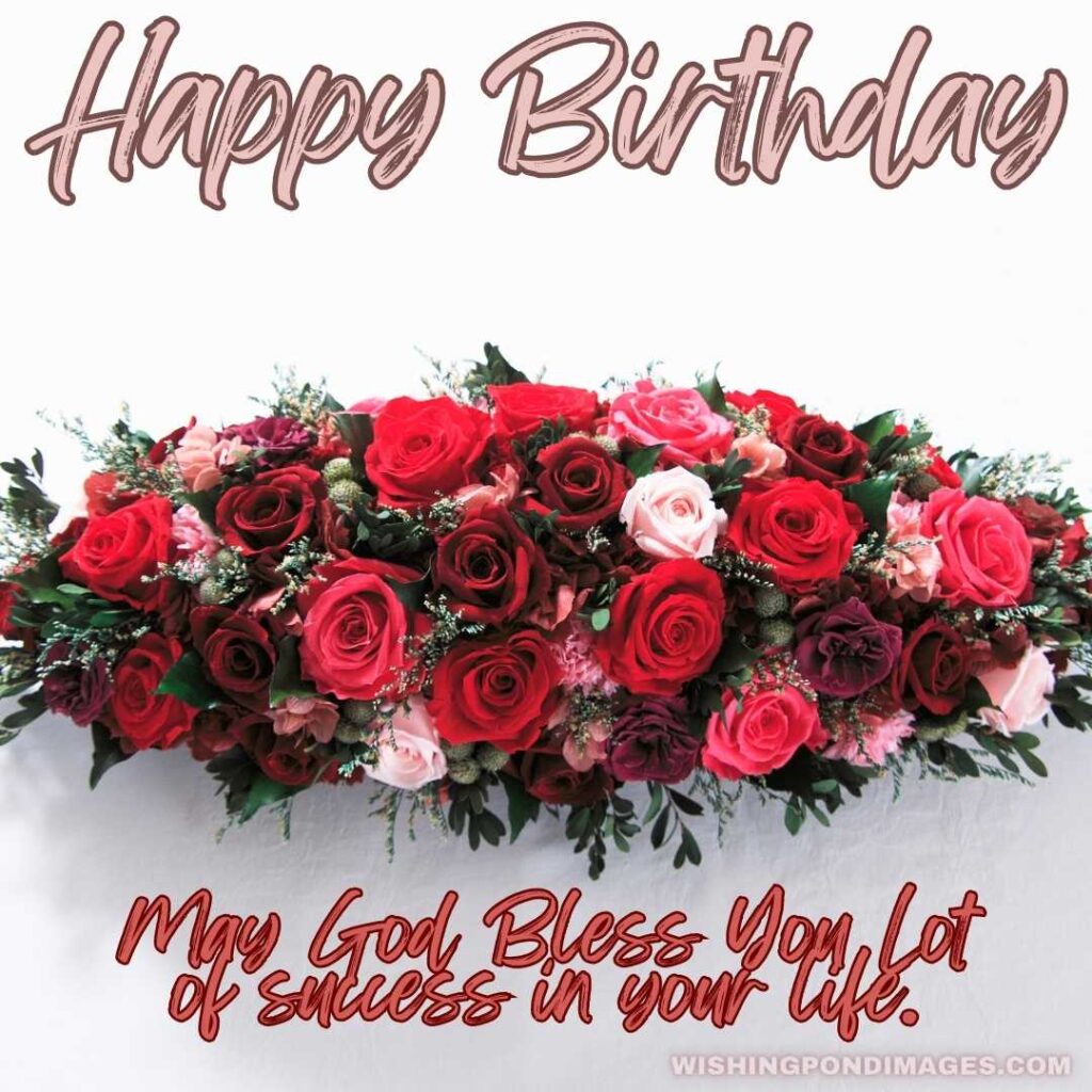 A bouquet of red roses with light pink flowers on the white surface table. Happy birthday flowers images