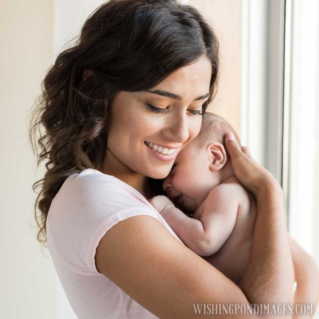A young mother with her newborn baby. Newborn baby images