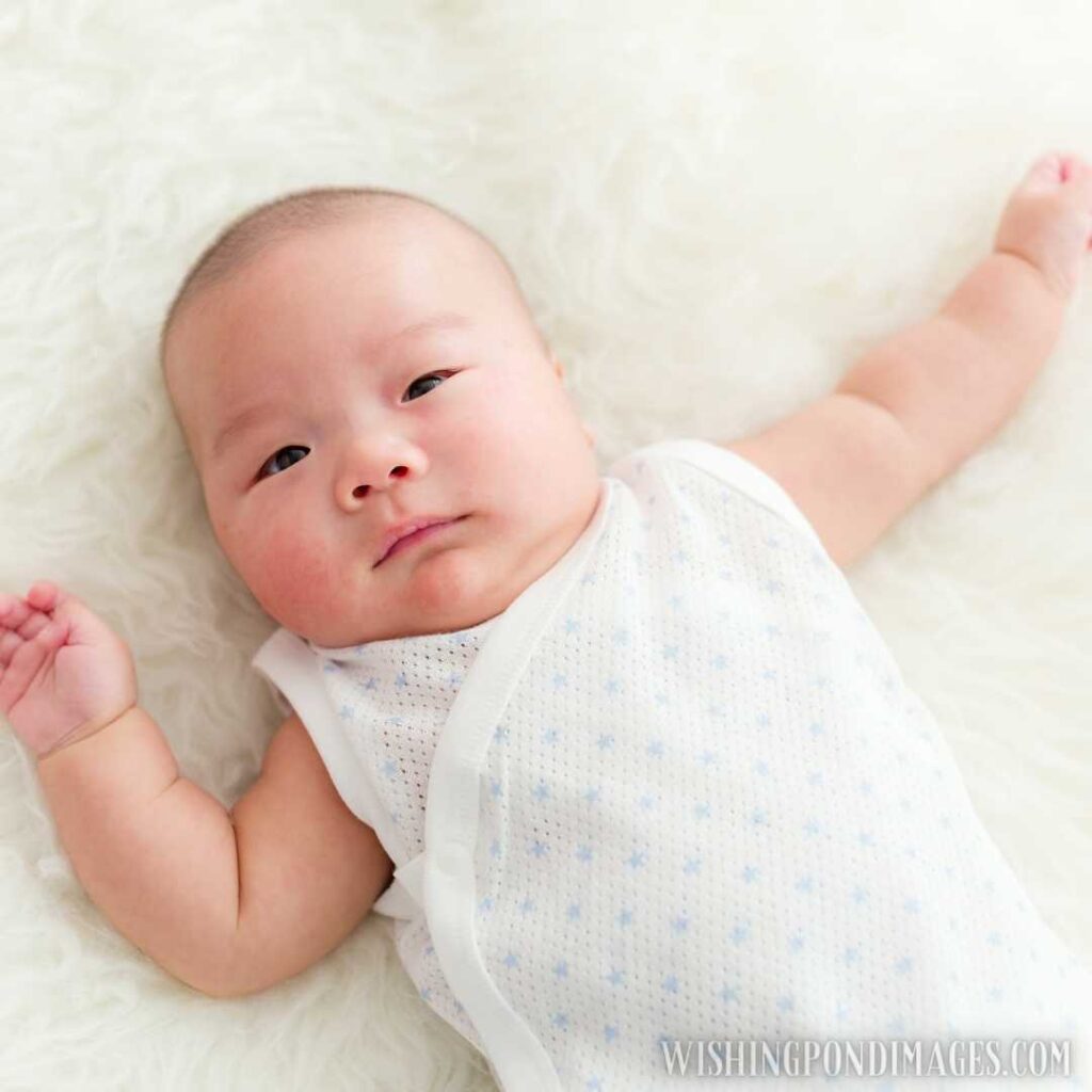 Asian little cute baby lying on bed. Newborn baby images