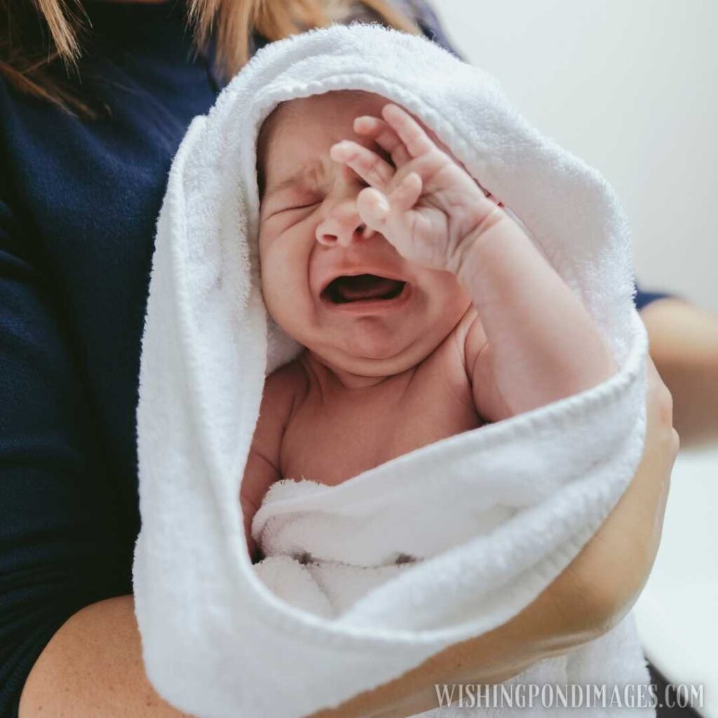 Newborn baby girl crying. Newborn baby images
