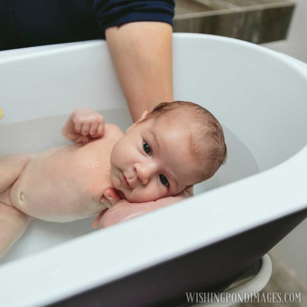 Newborn baby in the bathtub. Newborn baby images
