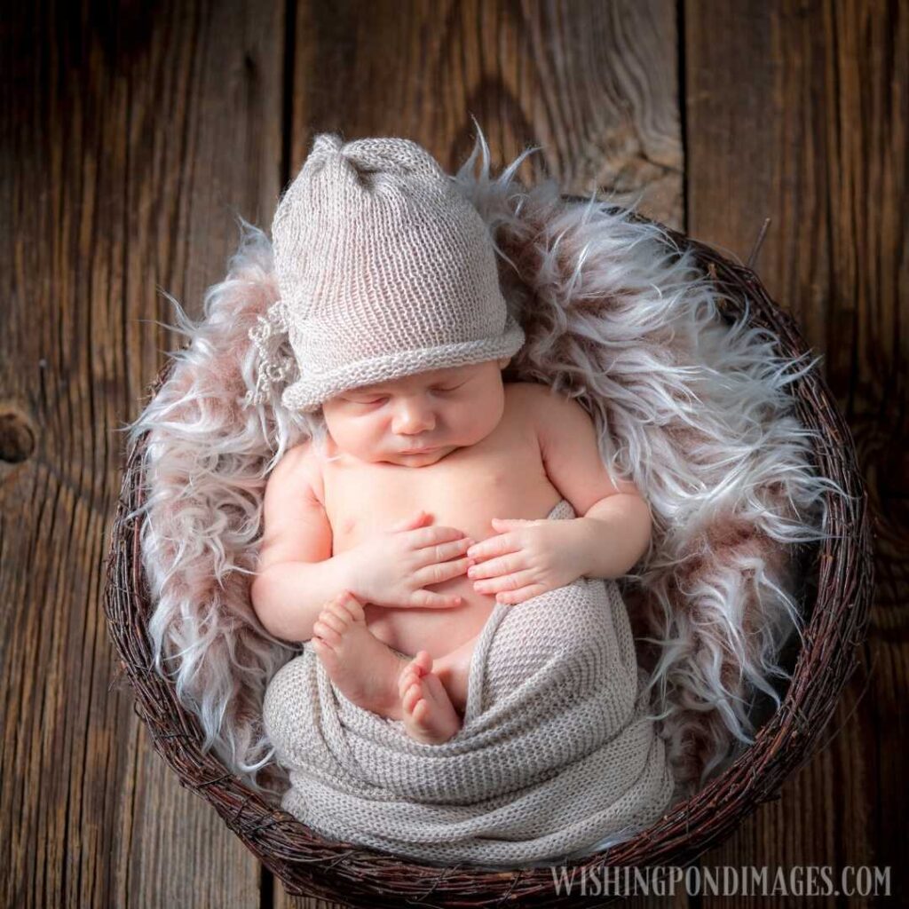 Sweet newborn infant sleeping on the blanket. Newborn baby image