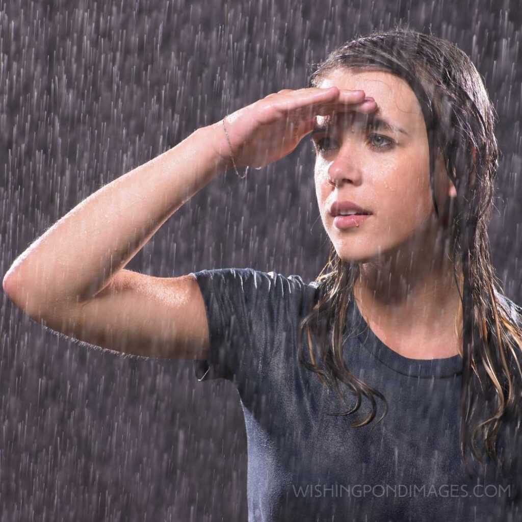 A beautiful teenage girl standing in the rain. Feeling alone images girl.
