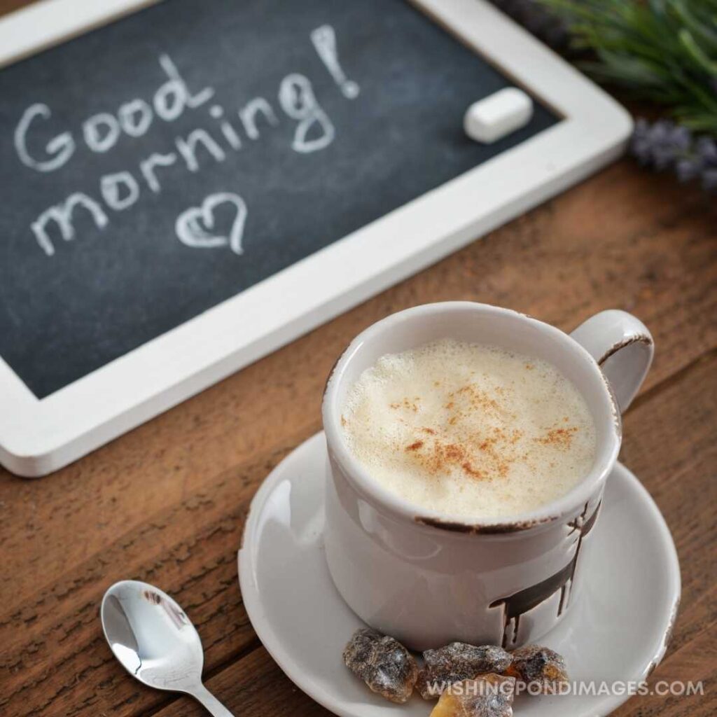 A cup of coffee on the table with a slate Good Morning written on it. Good Morning Coffee Images