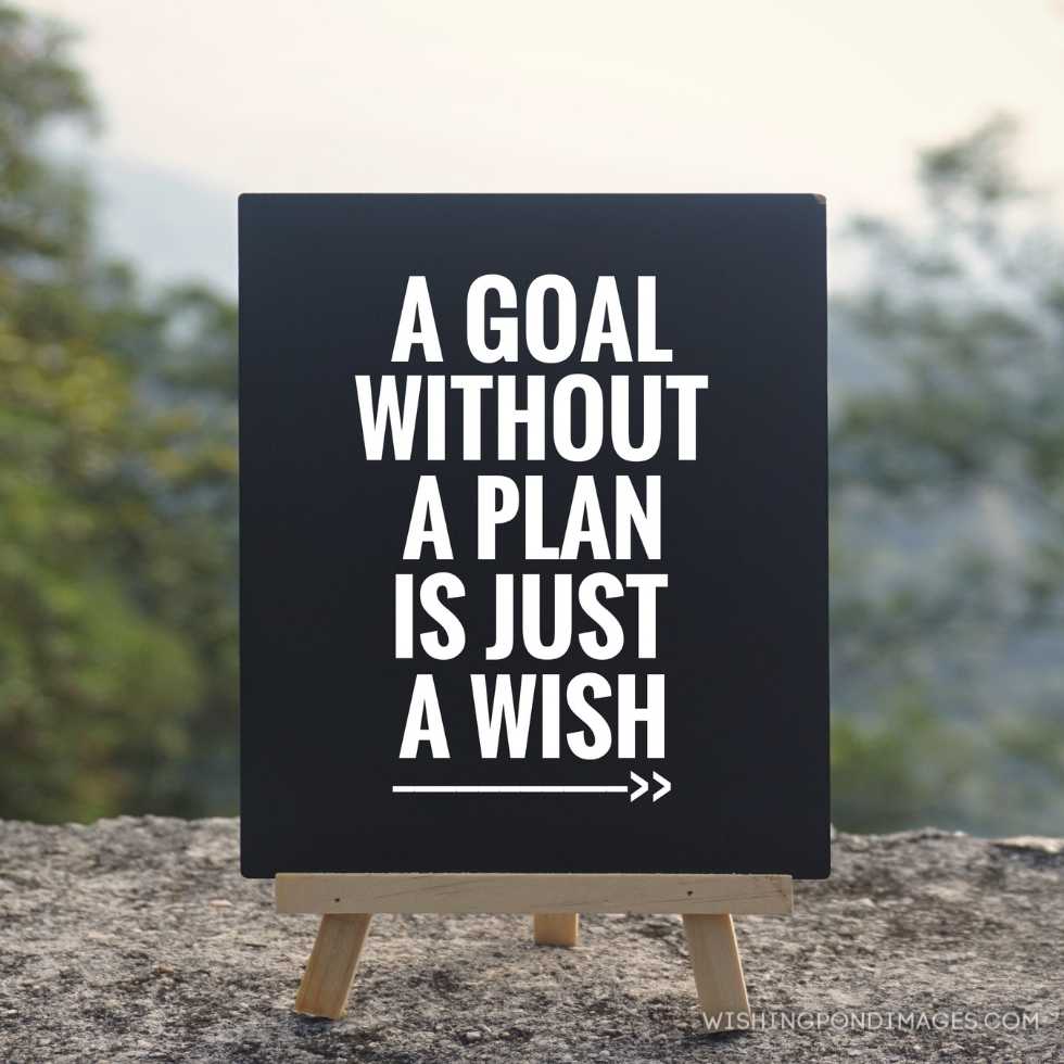 'A goal without a plan is just a wish' written on a blackboard. Blurred styled background. Inspirational quote images