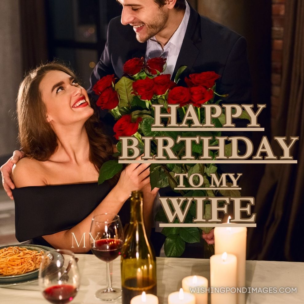 A man giving roses to his wife. Happy birthday wife images.