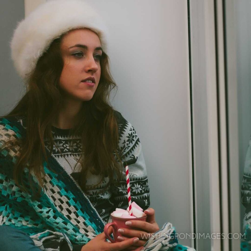 Beautiful girl sitting alone on a Christmas day. Feeling alone images girl.