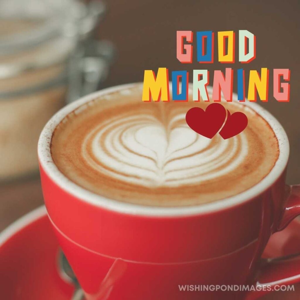Hot coffee with beautiful steamed milk on top served in the red cup. Good Morning Coffee Images
