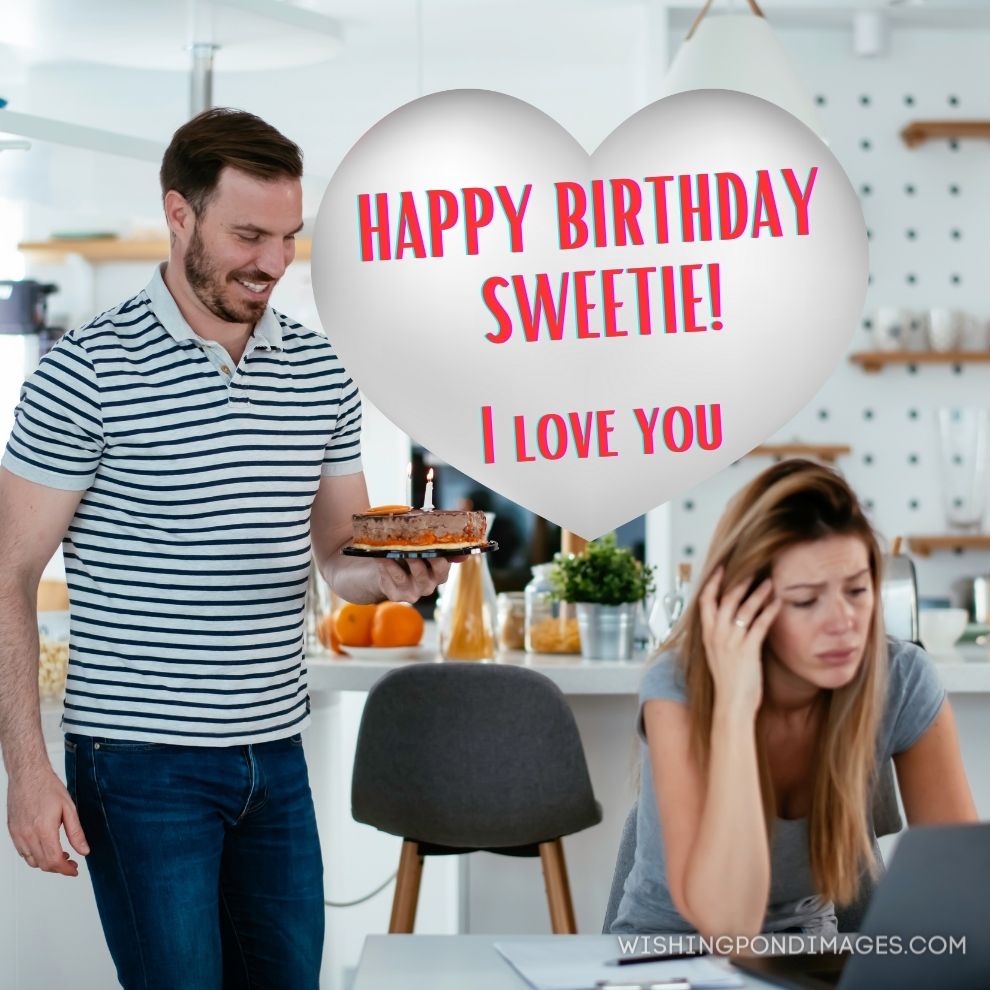 Husband surprise his wife with birthday cake. Happy birthday wife images.