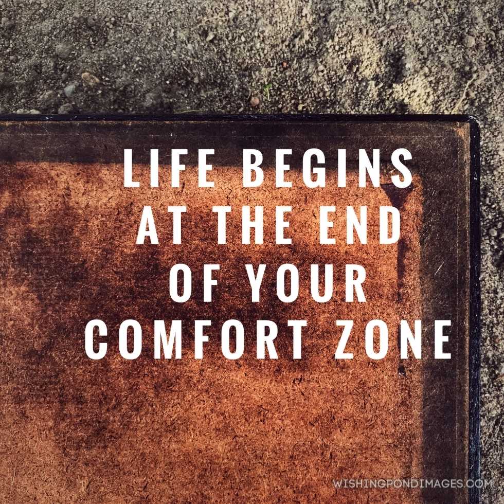 'Life begins at the end of your comfort zone written on an old board. Inspirational quote images