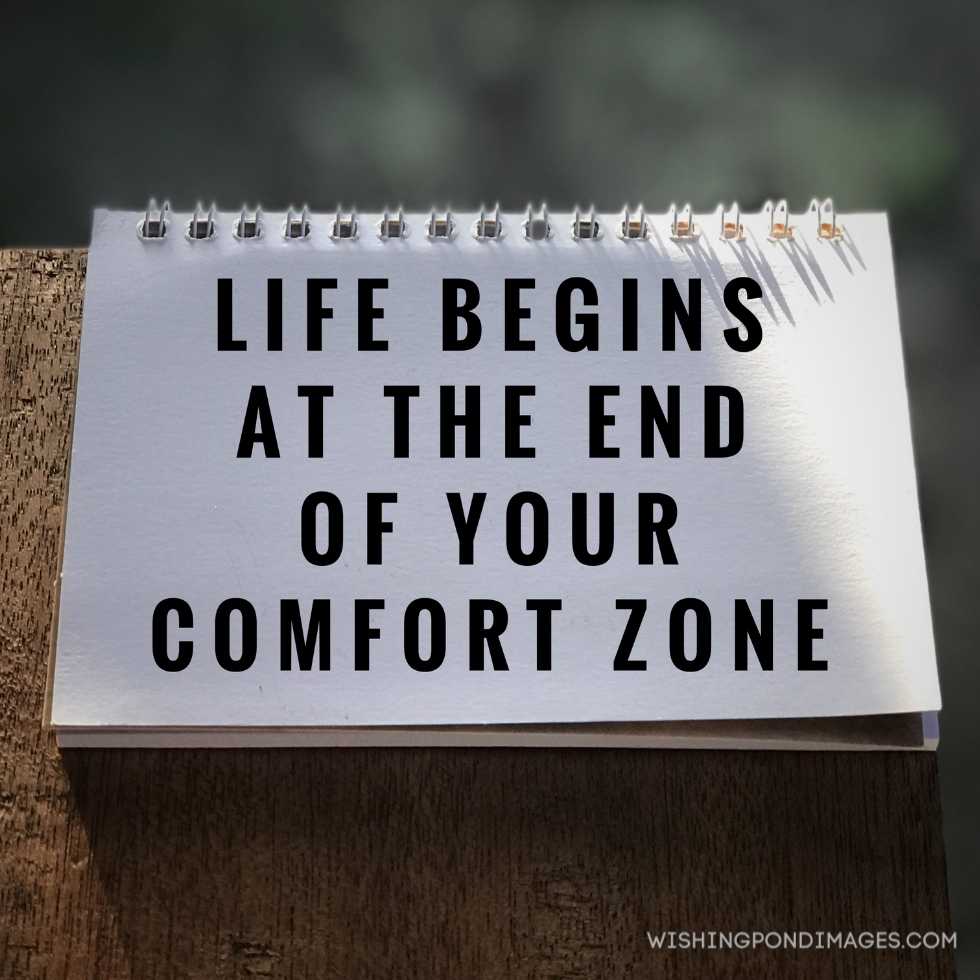 'Life begins at the end of your comfort zone' written on white paper blurred styled background. Inspirational quote images