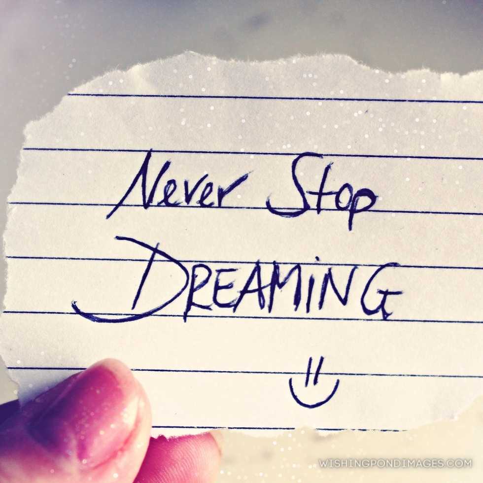 Motivational and inspirational quote written on a piece of paper. Never stop dreaming. Inspirational quote images