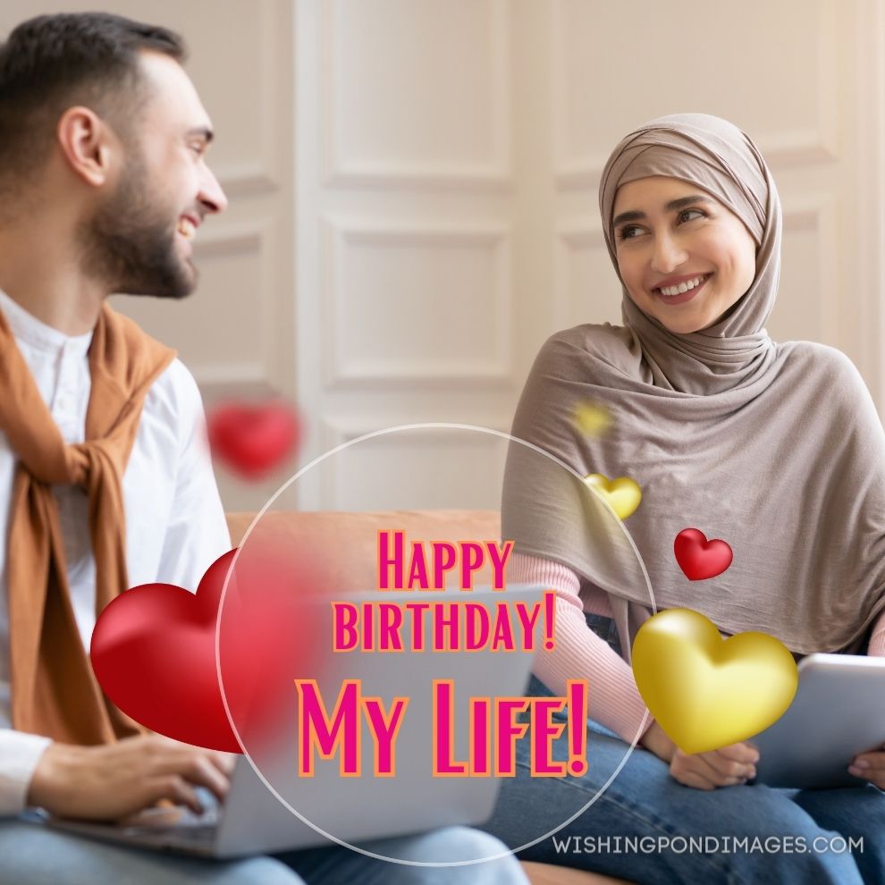 Muslim couples using computers laptops and digital tablet siting on sofa at home. Happy birthday wife images.