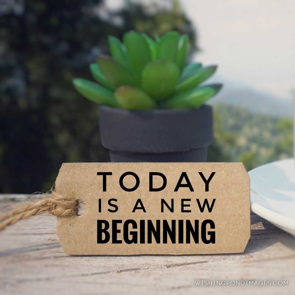 'Today is a new beginning written on a paper tag. Blurred styled background. Inspirational quote images