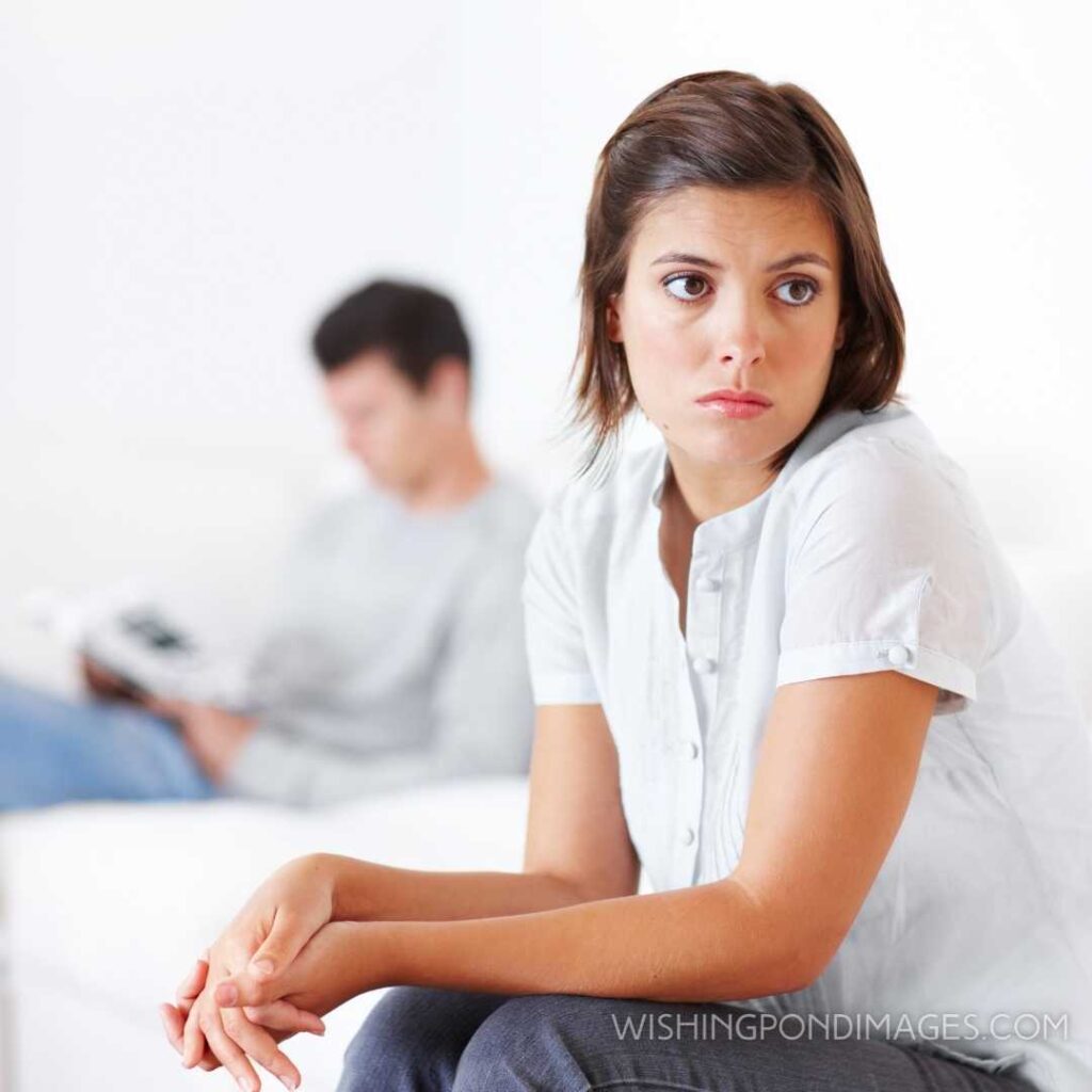 Woman sitting away from her boyfriend and looking away miserably. Feeling alone images girl.