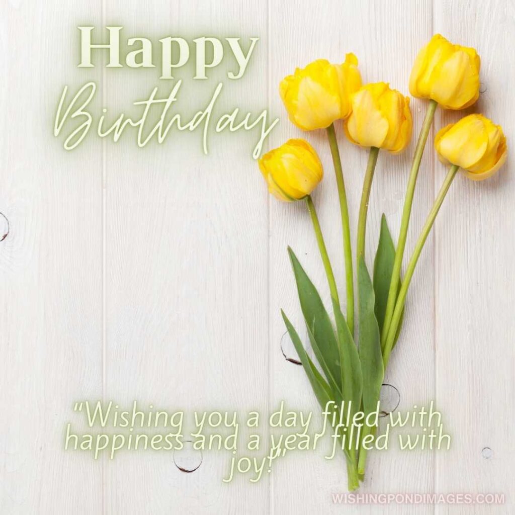 Yellow tulips flowers on white wooden background. Happy birthday tulips flowers images