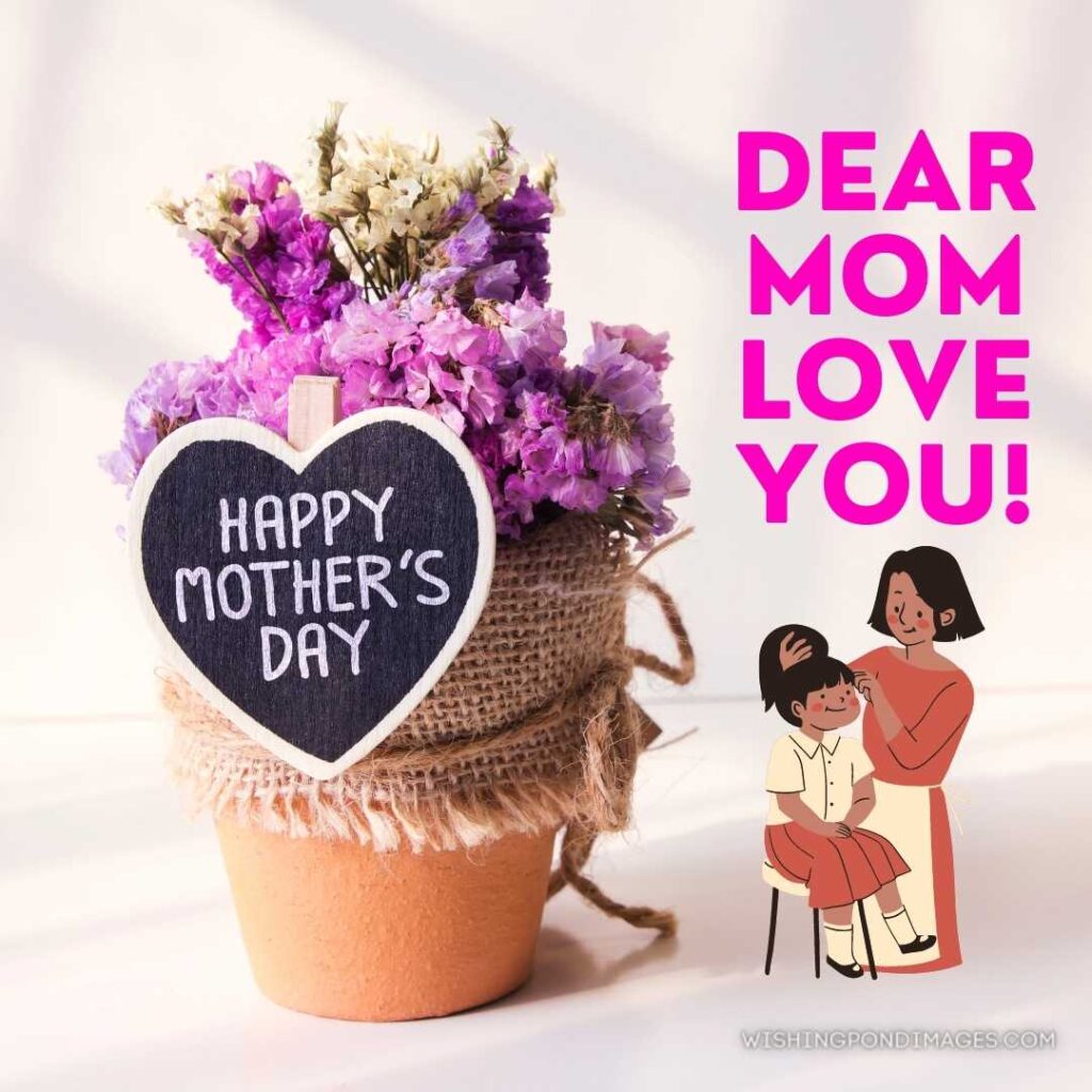 A little cute pot with pink flowers and heart shape happy mother's day written on it. Happy Mothers Day images