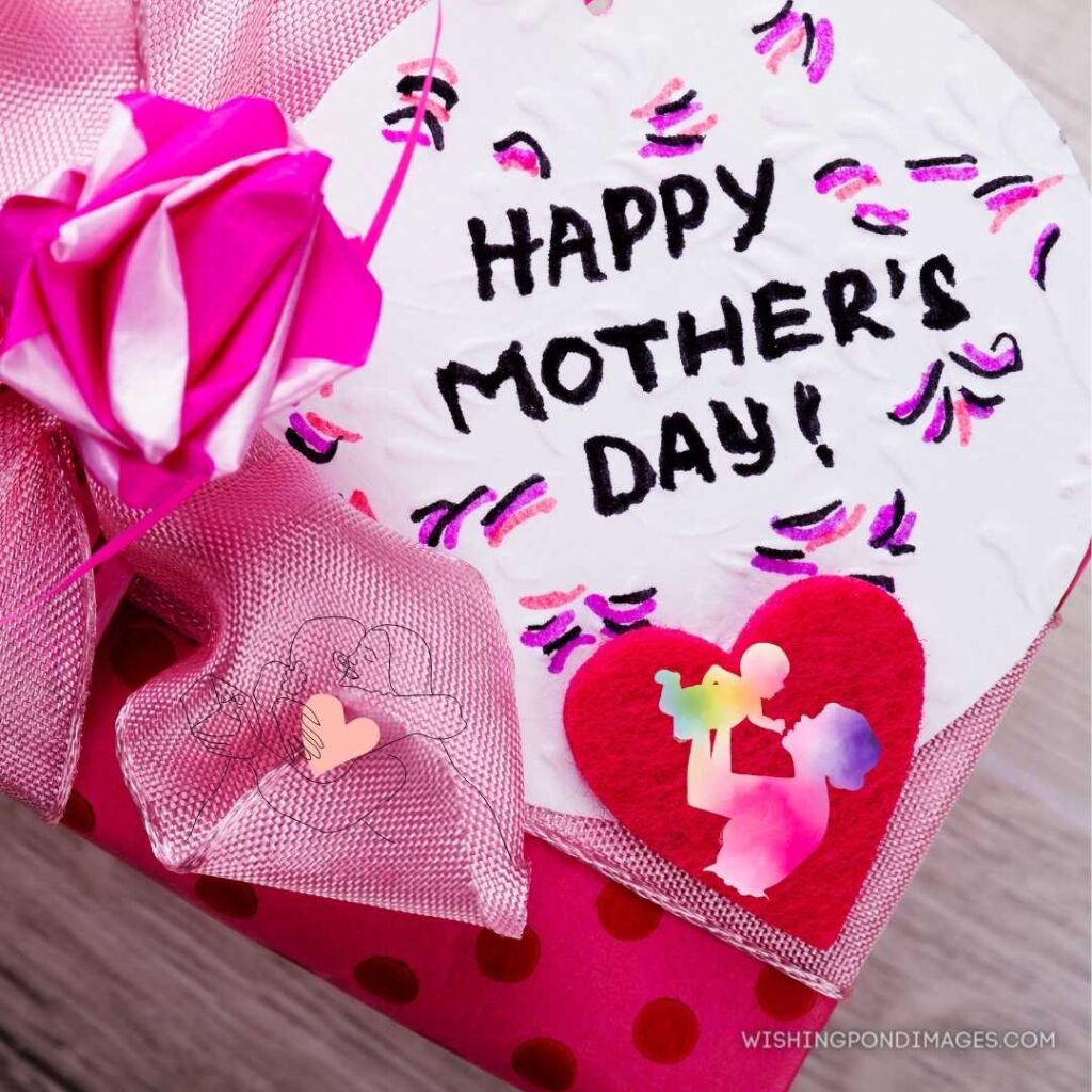 Happy Mother's Day card inscription pink bow on gift box. Happy Mothers Day images