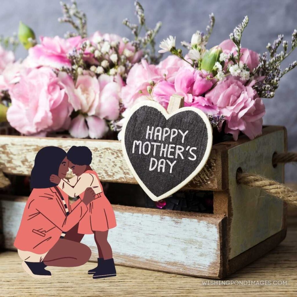 Pink carnation flowers in vintage box with happy mothers day letter on wood heart. Happy Mothers Day images