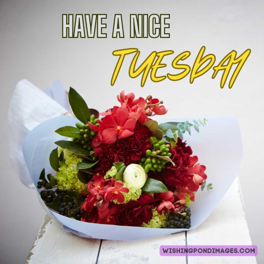 A flower bouquet on the wooden table on a light background. Good morning Happy Tuesday images