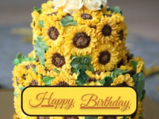 A two-layered sunflower flower cake sitting on the golden surface table. Happy birthday cake flowers images