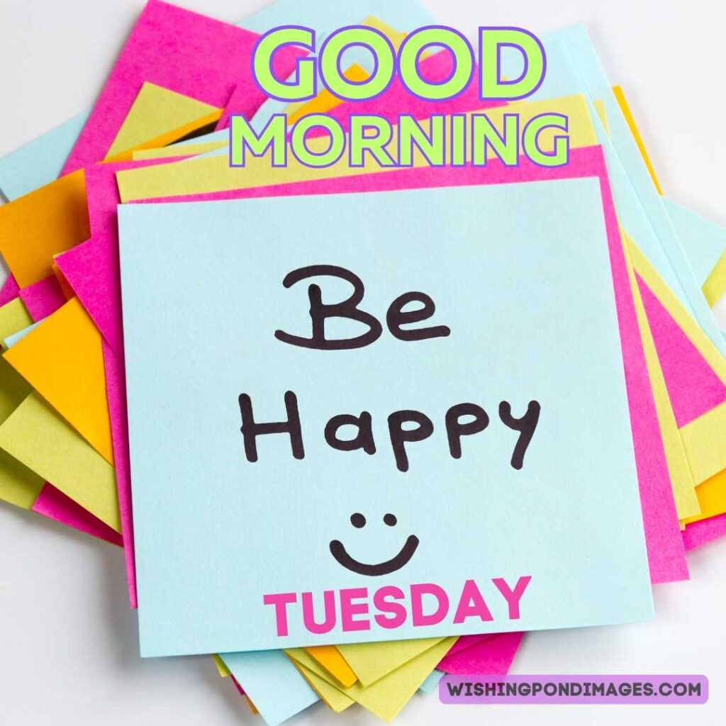 Be happily written with drawn smiley on colorful sticky notes on the table. Good morning Happy Tuesday images